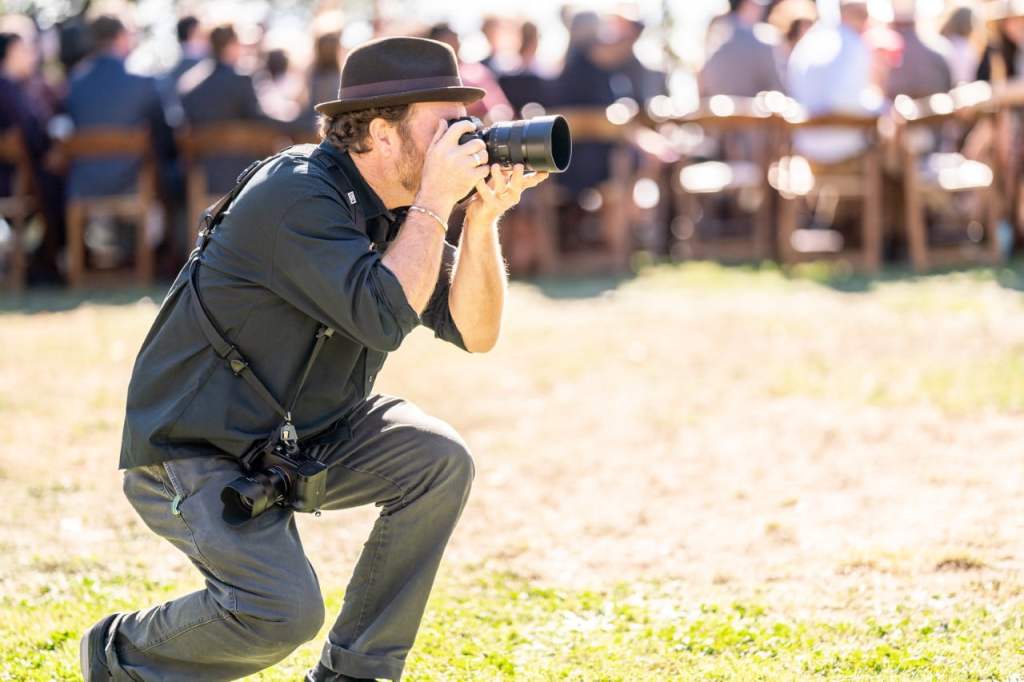 Here's me shooting a wedding a few months ago with my BLACKRAPID Double Breathe strap.